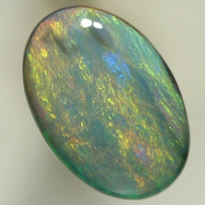 SOLID SEMI BLACK OPAL Sheen pattern with orange and yellow over a background of ocean blue